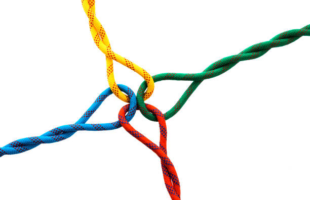 istock Colored ropes tied on white background 962162868