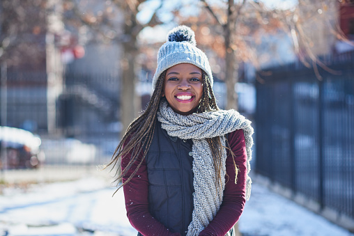Portrait of a beautiful young woman enjoying a wintery day outdoors