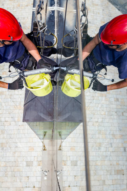 istock View on applying silicone sealant with gun on joints between windows 962169610