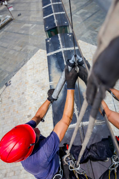 istock View on applying silicone sealant with gun on joints between windows 962169682