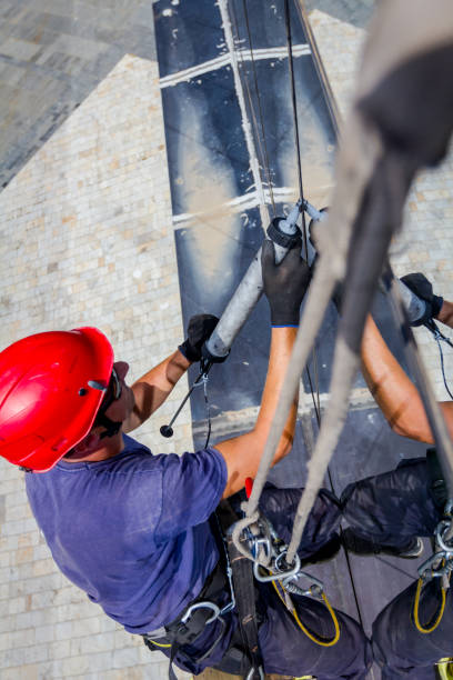 istock View on applying silicone sealant with gun on joints between windows 962169770