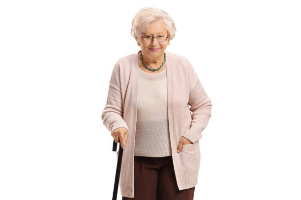 istock Elderly woman with a walking cane 962174062