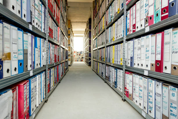 Office file folders, Stack of documents in binders, Bureaucracy Stacks of files and paperwork placed in bookshelves with folders and documents in binders archive, storage room. document storage stock pictures, royalty-free photos & images