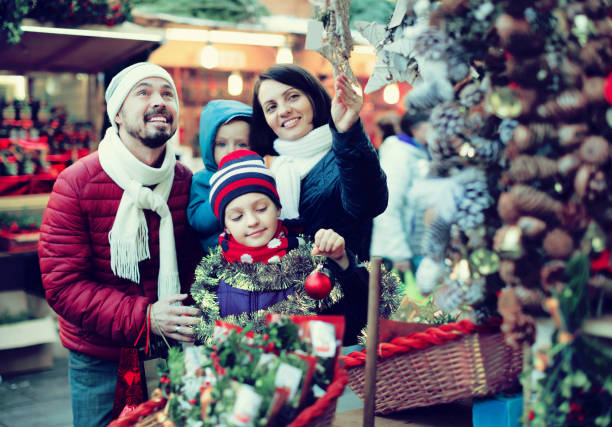 istock Family purchasing Christmas decoration 962174380
