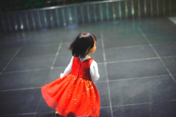 A little girl running away at night