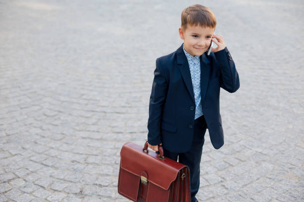 istock Future businessman with briefcase and phone 962177400