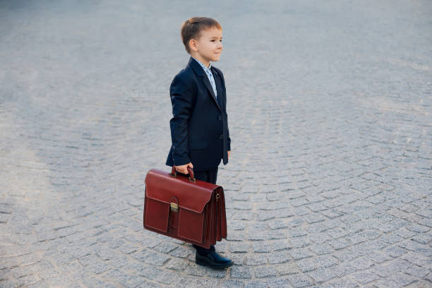 istock Future businessman in formal costume with briefcase 962177610