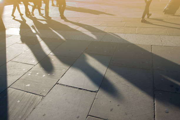 istock Silhouette of people walking. 962179340