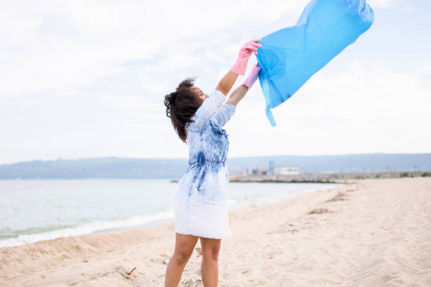 istock Young woman getting ready for local clean up 962182176