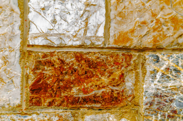 old stone placed in the wall, interesting and original background, solid wall