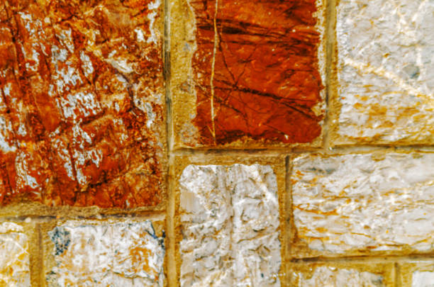old stone placed in the wall, interesting and original background, solid wall