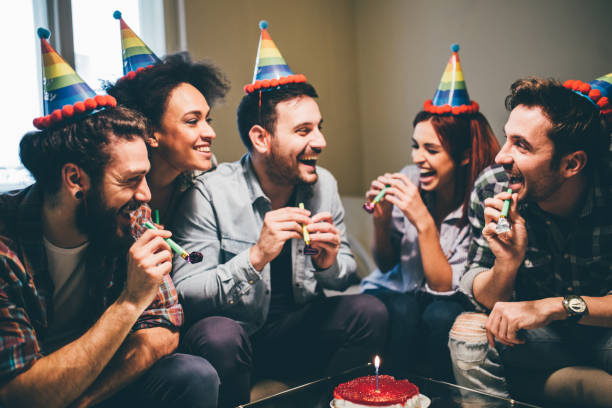 istock Friends laughing while celebrating birthday at home 962187340