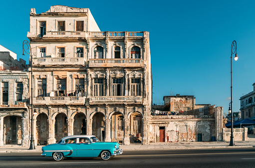 Old American car speeding along the Malecon in Havana, Cuba