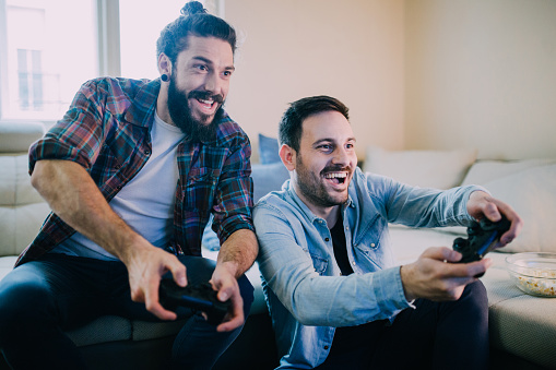 Gamers playing video games together from home