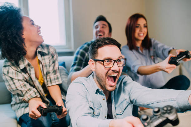 istock Man playing video games with friends and shouting 962192174