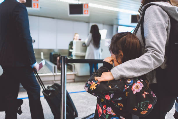 istock Young girl doesn't want to go on a plane 962192284