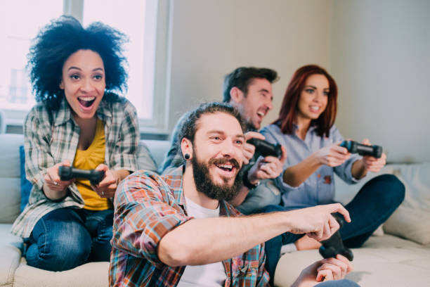 istock Group of friends playing video games 962192296