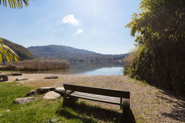istock View of lake landscape with a bench 962192432