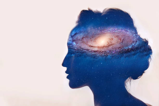 istock Girl with galaxy in head 962192554