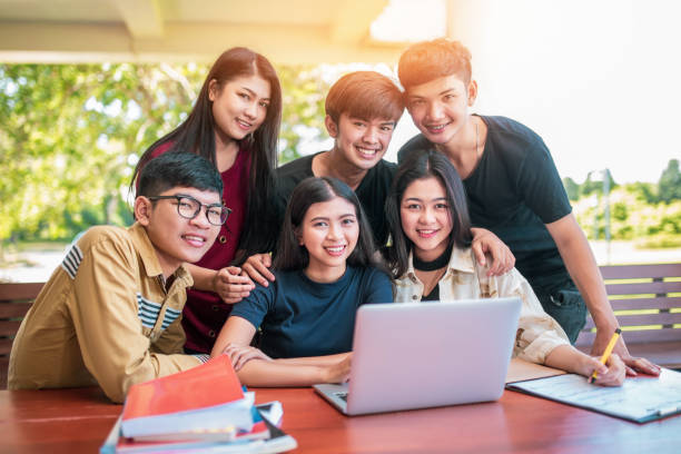 istock Back to school education knowledge college university concept, Young people being used computer and tablet, Education and technology concept. 962193934