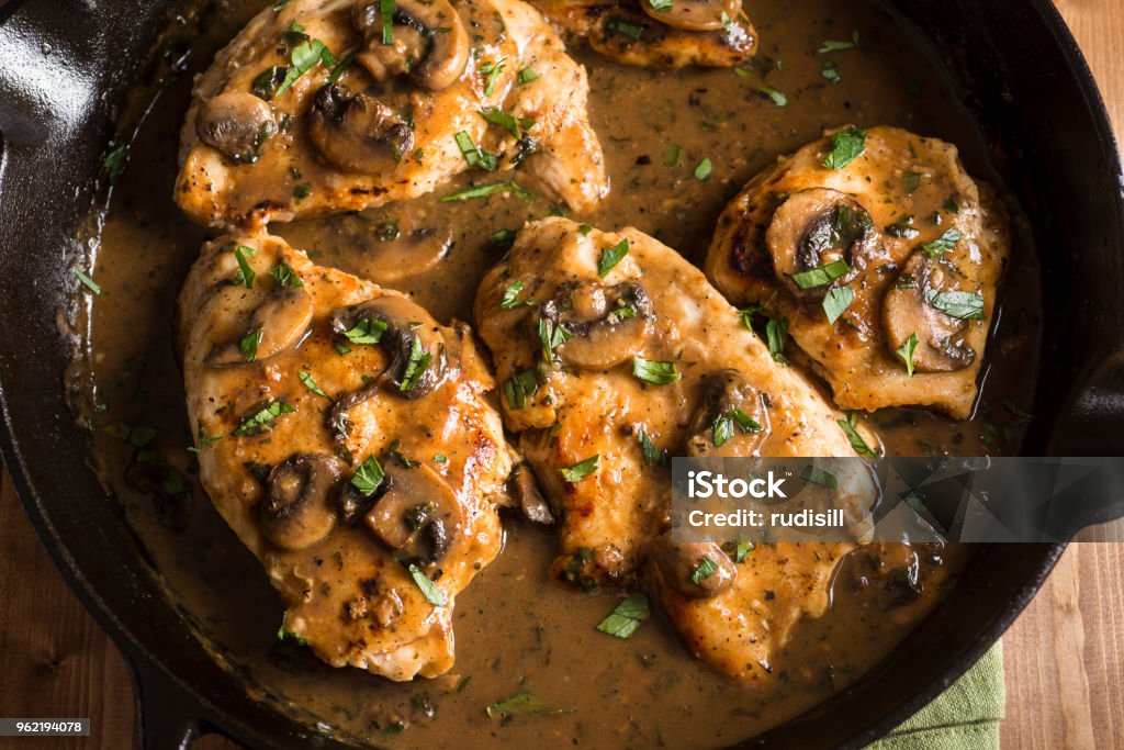 Chicken Marsala Chicken Marsala in a Cast Iron Skillet Chicken Meat Stock Photo