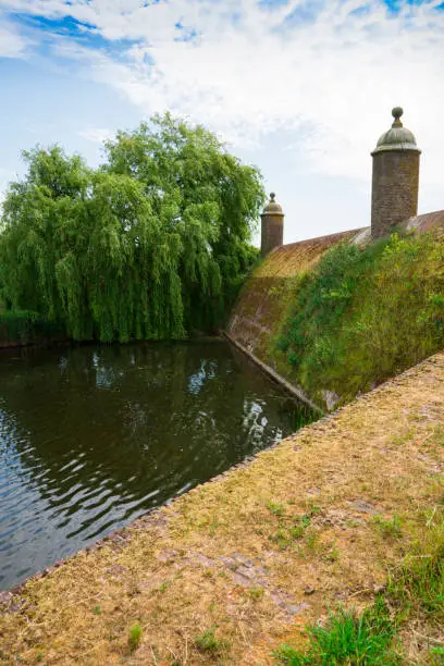 historic dam made of brick in fortified town Klundert, Holland
