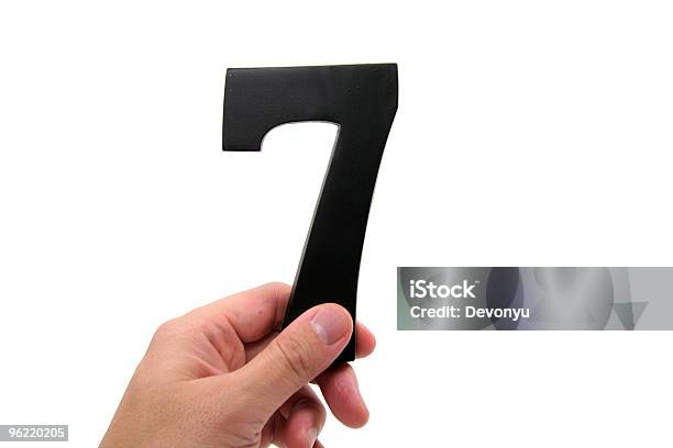 Hand Holding Number 7 Stock Photo - Download Image Now - Black Color, Color Image, Cut Out