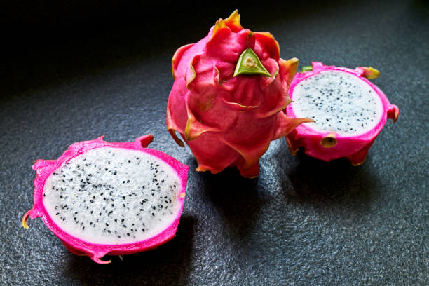 istock Fresh ripe dragon fruits isolated on granite plate background 962202336