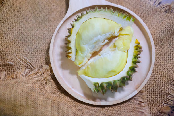 istock Traditional famous Thai fruit DURIAN on wooden plate 962202482