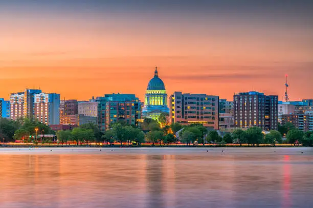 Madison, Wisconsin, USA downtown skyline at dusk on Lake Monona.