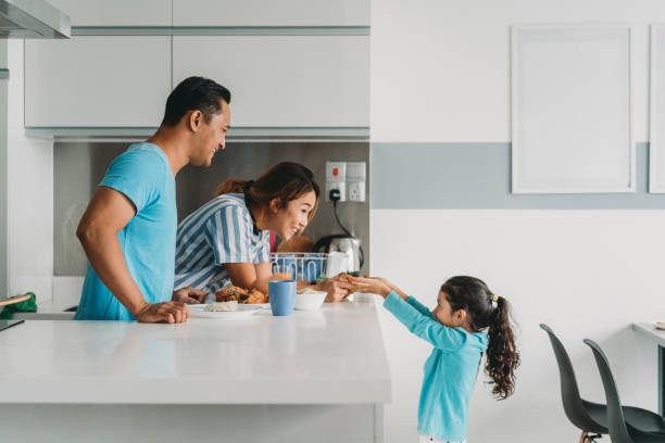 istock Affectionate family preparing lunch at home 962203240