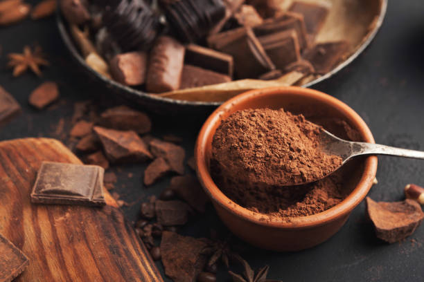 istock Cocoa bowl and crushed chocolate pieces on gray background 962204036