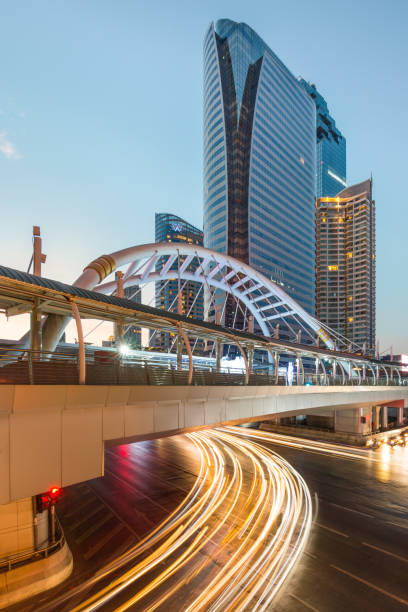 istock the light car line under the bridge and tall building 962204440