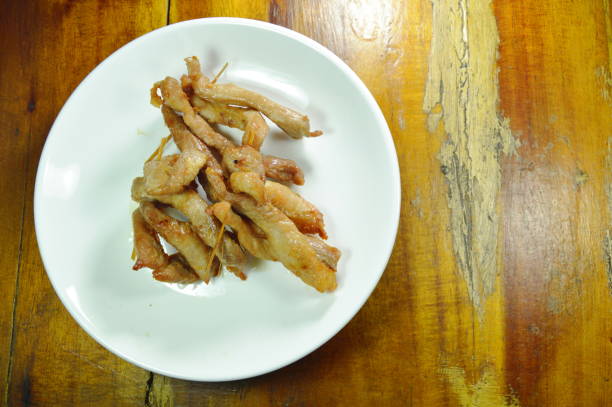 istock fried slice pork stabbing with wooden stick 962206998