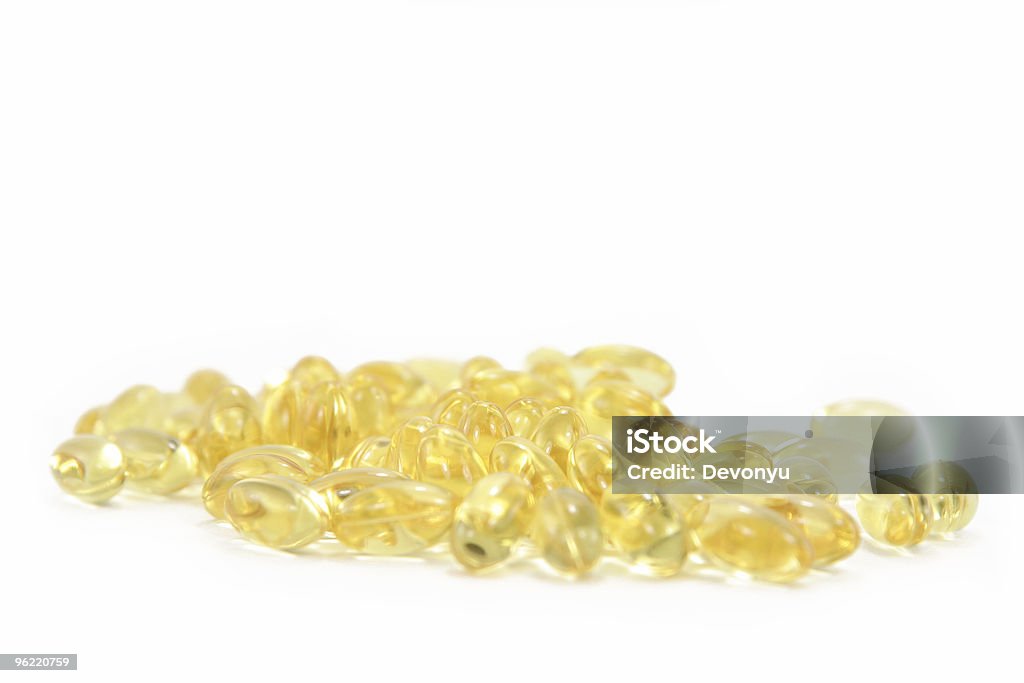 bunch of yellow gel pills  Capsule - Medicine Stock Photo