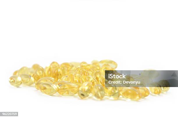 Bunch Of Yellow Gel Pills Stock Photo - Download Image Now - Capsule - Medicine, Color Image, Dairy Product