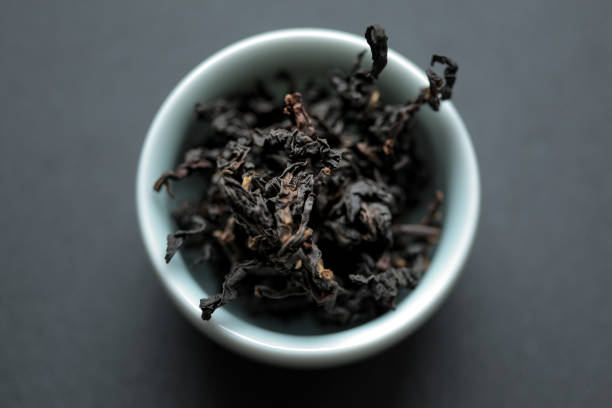 Organically-grown Taiwanese black tea of the Daye Oolong cultivar in a celadon teacup.