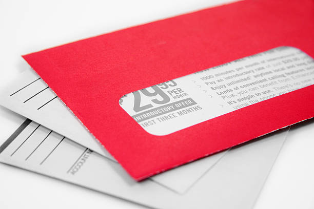 istock One red advertising envelope on top of two white ones 96221076