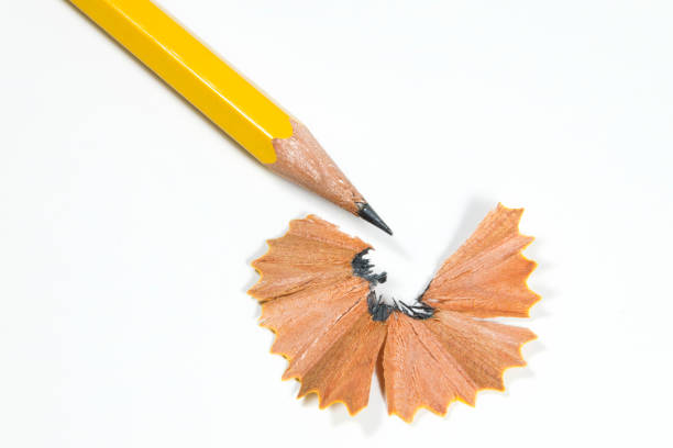 istock wooden pencil shavings on white paper background 962211534