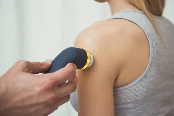 istock Physiotherapist performing ultrasound therapy of the shoulder 962211706