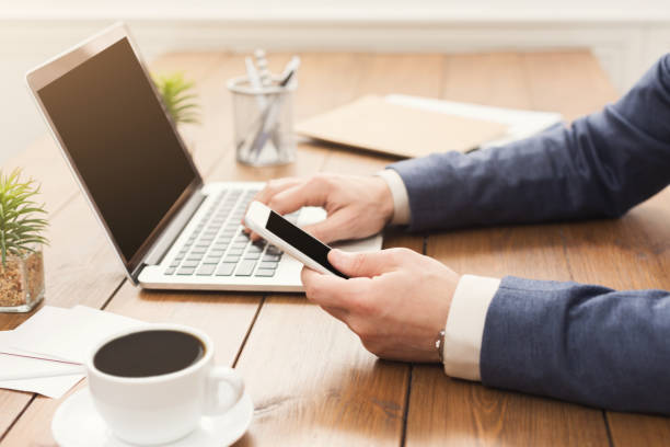 istock Unrecognizable businessman typing on laptop 962215218