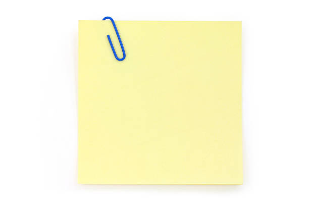 istock blue paper clip with yellow notepaper 96222219