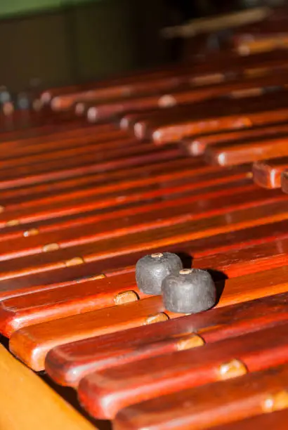 Photo of Close-up shot of a marimba or Hormigo keyboard. Guatemala. National instrument of Guatemala made with Hormigo wood the marimba keyboard.