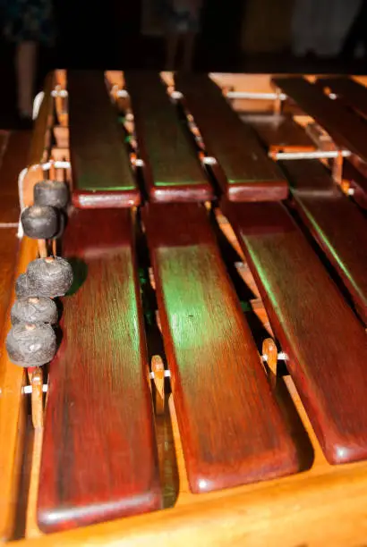 Photo of Close-up shot of a marimba or Hormigo keyboard. Guatemala. National instrument of Guatemala made with Hormigo wood the marimba keyboard.