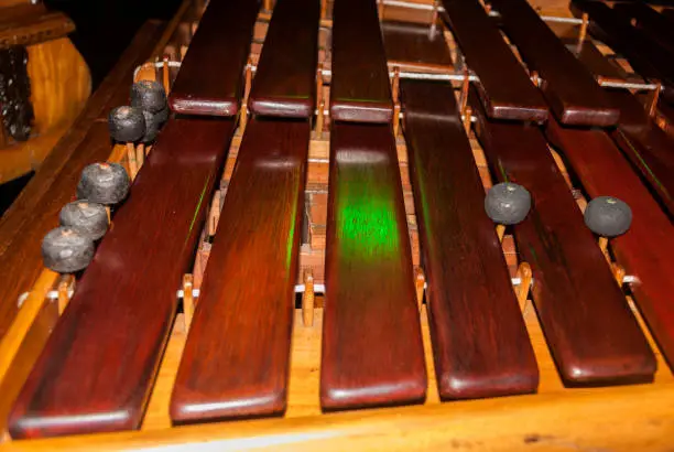 Photo of Close-up shot of a marimba or Hormigo keyboard. Guatemala. National instrument of Guatemala made with Hormigo wood the marimba keyboard.