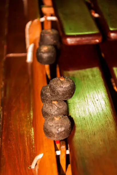 Photo of Close-up shot of a marimba or Hormigo keyboard. Guatemala. National instrument of Guatemala made with Hormigo wood the marimba keyboard.