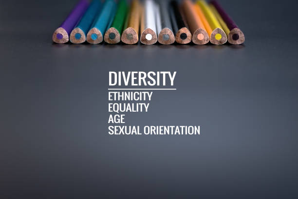 istock Diversity concept. row of mix color pencil on black background with text Diversity, Ethnicity, Equality, Age, Sexual Orientation 962224242