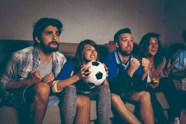 istock Friends watching a football match 962225288