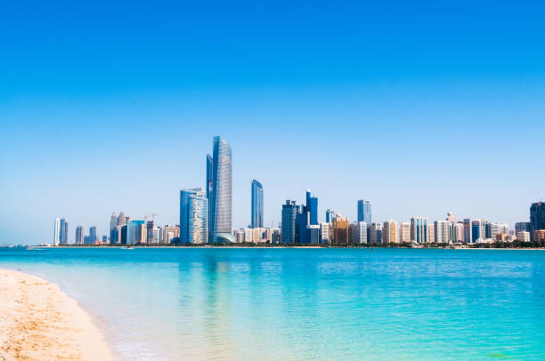 istock Abu Dhabi skyline and city scene shots from white sand beach 962225740