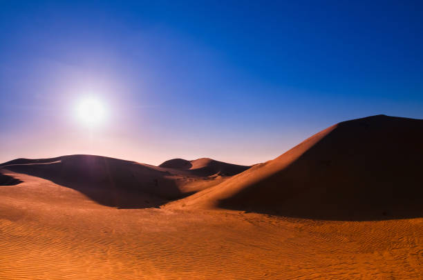 istock Al Wathna desert and sand dunes of Abu Dhabi before dramatic sunset 962225748